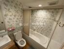 Bathroom with bathtub and floral tile design