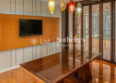 Modern dining room with wooden table and decorative lighting