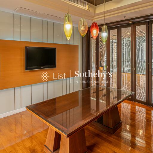 Modern dining room with wooden table and decorative lighting