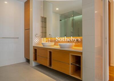 Modern bathroom with dual sinks and large mirror