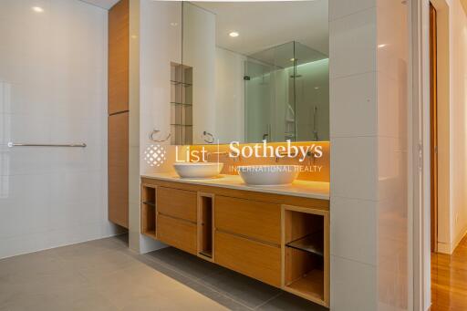 Modern bathroom with dual sinks and large mirror