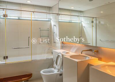 Modern bathroom with dual sinks and bathtub