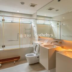 Modern bathroom with dual sinks and bathtub