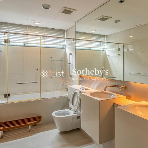 Modern bathroom with dual sinks and bathtub