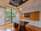 Modern dining area with glass table and stylish lighting