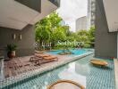 Outdoor area with pool and lounge chairs