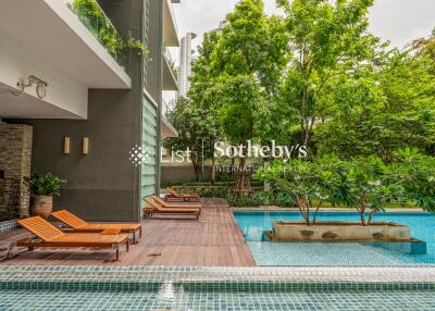 Outdoor area with pool and loungers