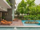 Outdoor area with pool and loungers