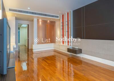 Modern living room with wooden flooring and built-in shelving