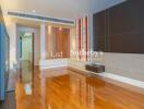 Modern living room with wooden flooring and built-in shelving