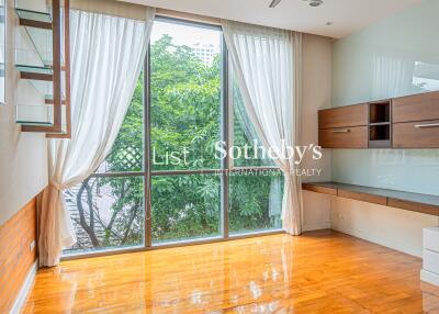 Spacious living room with large windows and abundant natural light