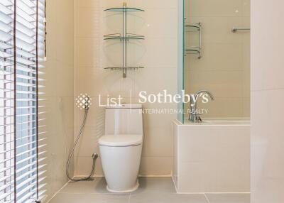 Modern bathroom with glass shelves and bathtub