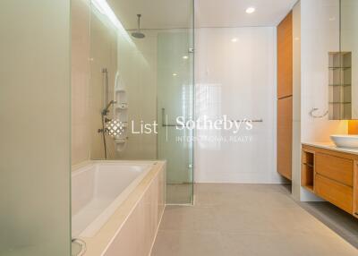 Modern bathroom with glass shower and soaking tub