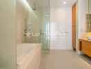 Modern bathroom with glass shower and soaking tub