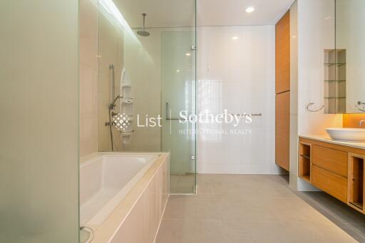 Modern bathroom with glass shower and soaking tub