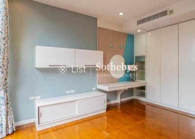 Modern bedroom with built-in storage and vanity