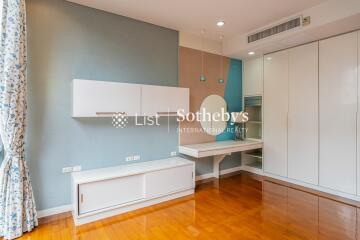 Modern bedroom with built-in storage and vanity