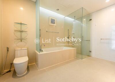 Modern bathroom with bathtub and glass shower enclosure