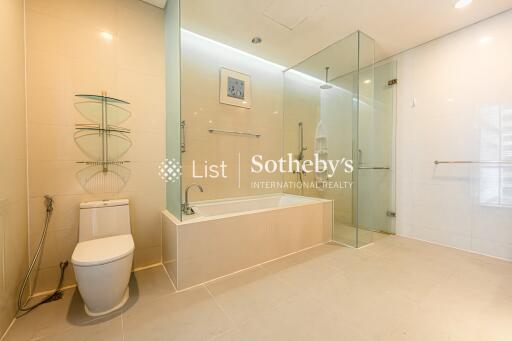 Modern bathroom with bathtub and glass shower enclosure