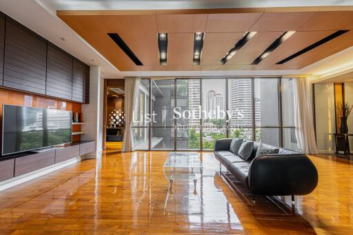 Modern living room with wooden flooring and a large sofa