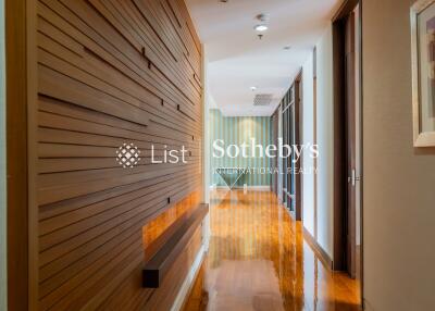 Modern hallway with wooden wall paneling and polished floor