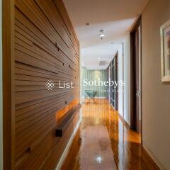 Modern hallway with wooden wall paneling and polished floor