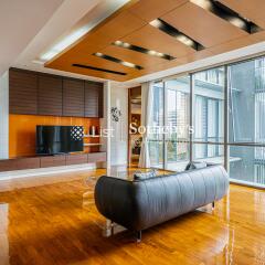 Modern living room with large windows and wooden floor