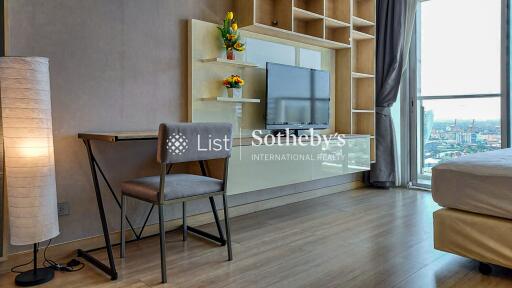 Modern living space with a writing desk and television