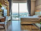 Spacious bedroom with work area and city view