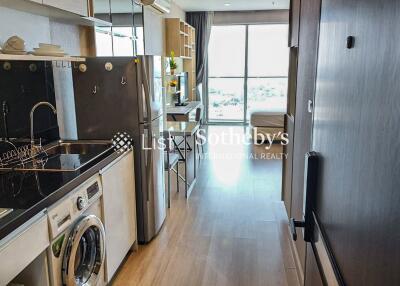 Modern kitchen with integrated appliances and dining area