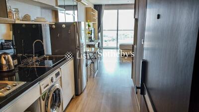 Modern kitchen with integrated appliances and dining area