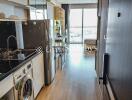 Modern kitchen with integrated appliances and dining area