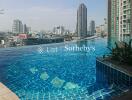 High-rise building with rooftop infinity pool and city view