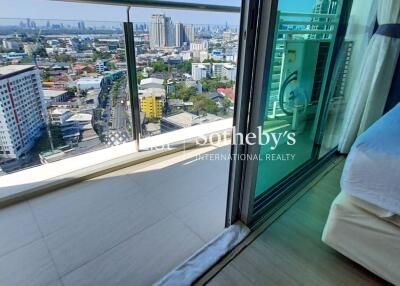 modern bedroom with balcony city view