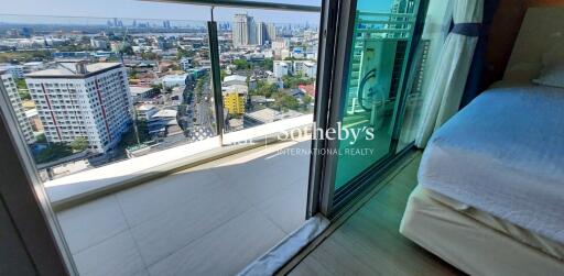 modern bedroom with balcony city view