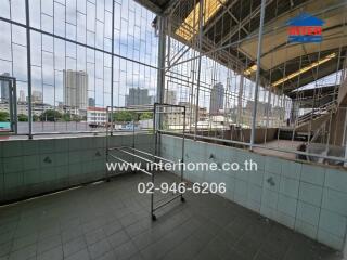 Balcony with tiled floor and city view