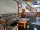 Living room with wooden staircase and furniture