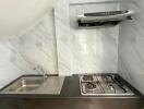 Modern kitchen with stainless steel sink and gas stove