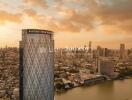 Skyline view of a city with the Banyan Tree Residences building in the foreground