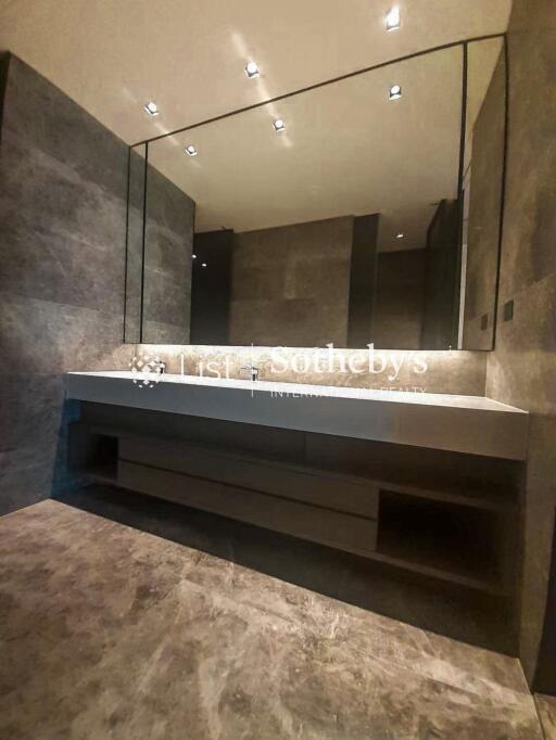 Modern bathroom with large mirror and sleek design