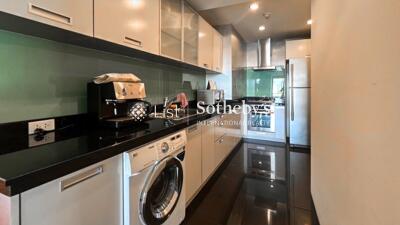 Modern kitchen with appliances and washing machine