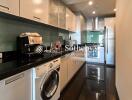 Modern kitchen with appliances and washing machine