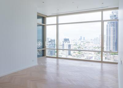 Modern living room with large windows and city view