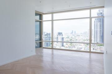 Modern living room with large windows and city view