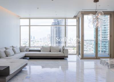 Spacious modern living room with large windows and city view