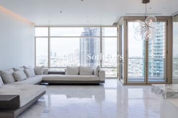 Spacious modern living room with large windows and city view