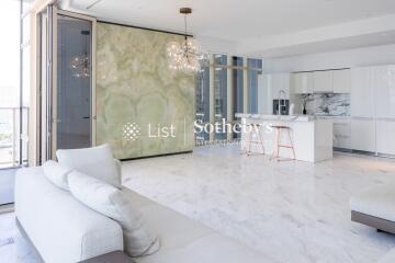 Modern living room with open kitchen and marble flooring