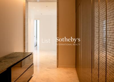 modern hallway with marble flooring and built-in cabinetry