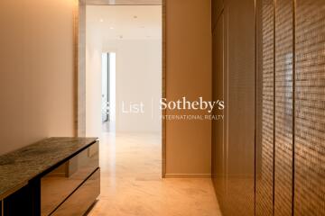 modern hallway with marble flooring and built-in cabinetry