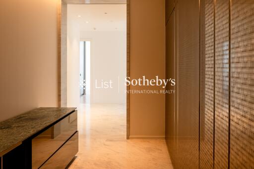 modern hallway with marble flooring and built-in cabinetry